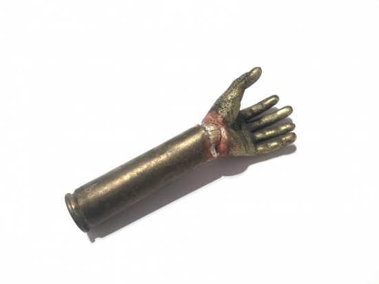 Brass hand object in bullet case    